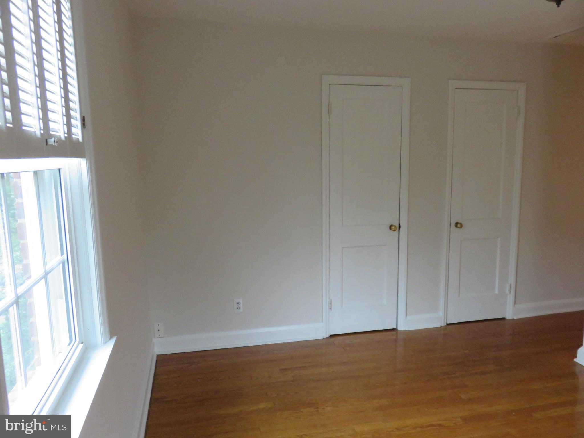 1930 Edgewood Road Baltimore, MD 21286 - Photo 18 of 30 a view of an empty room with wooden floor and a window