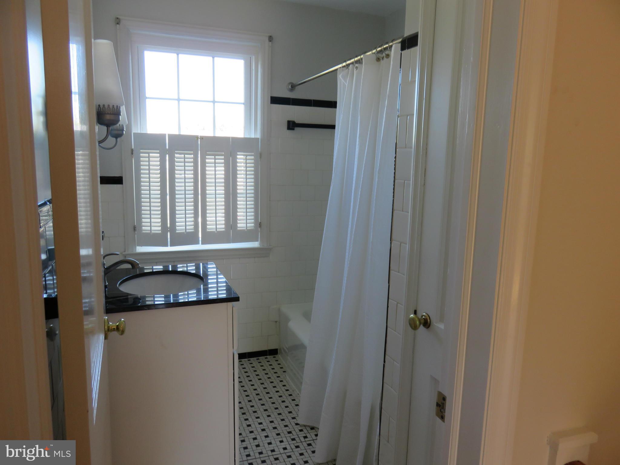 1930 Edgewood Road Baltimore, MD 21286 - Photo 20 of 30 a bathroom with a sink a toilet and shower