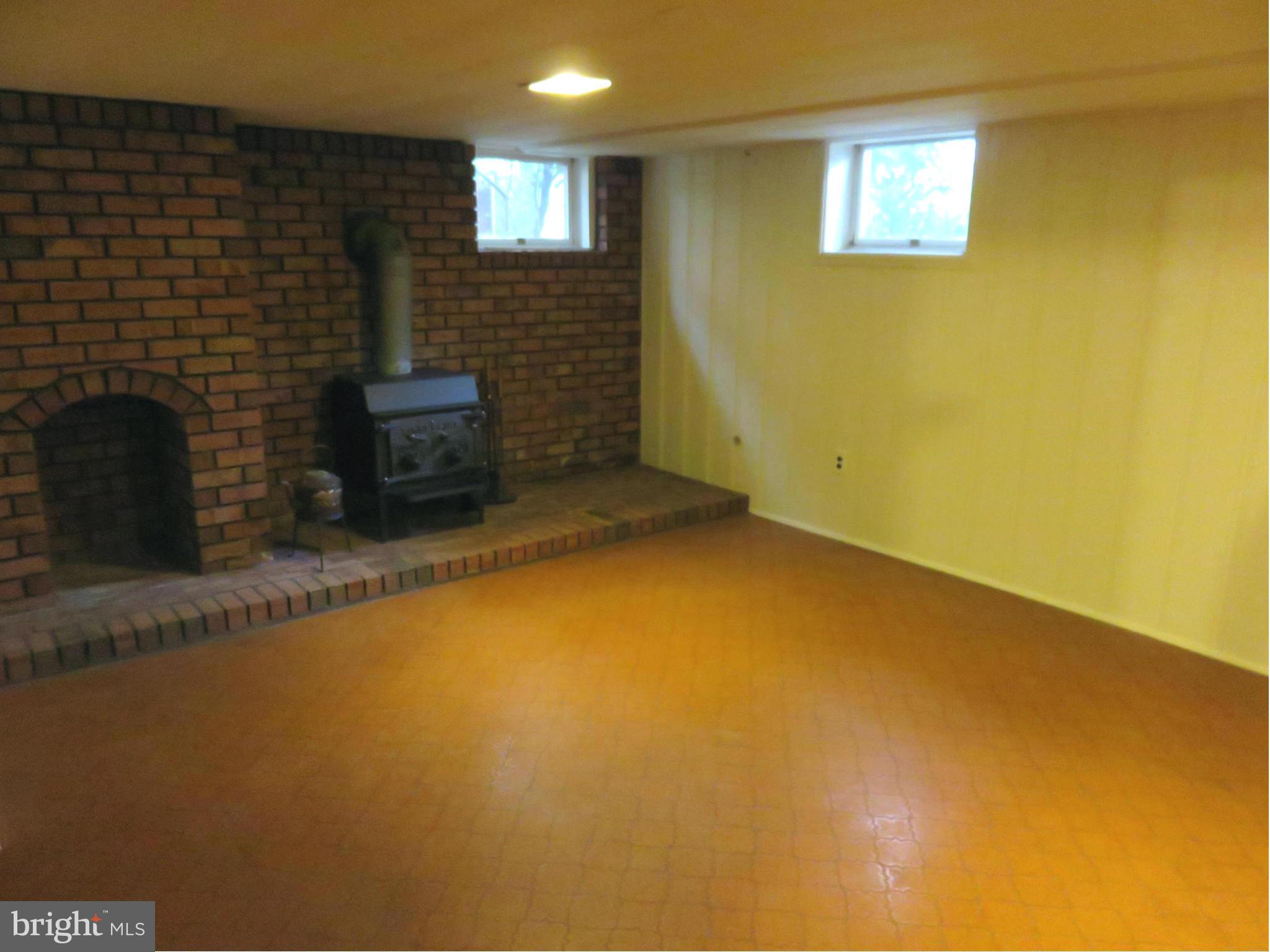 1930 Edgewood Road Baltimore, MD 21286 - Photo 23 of 30 a view of a livingroom with an empty space and a fireplace