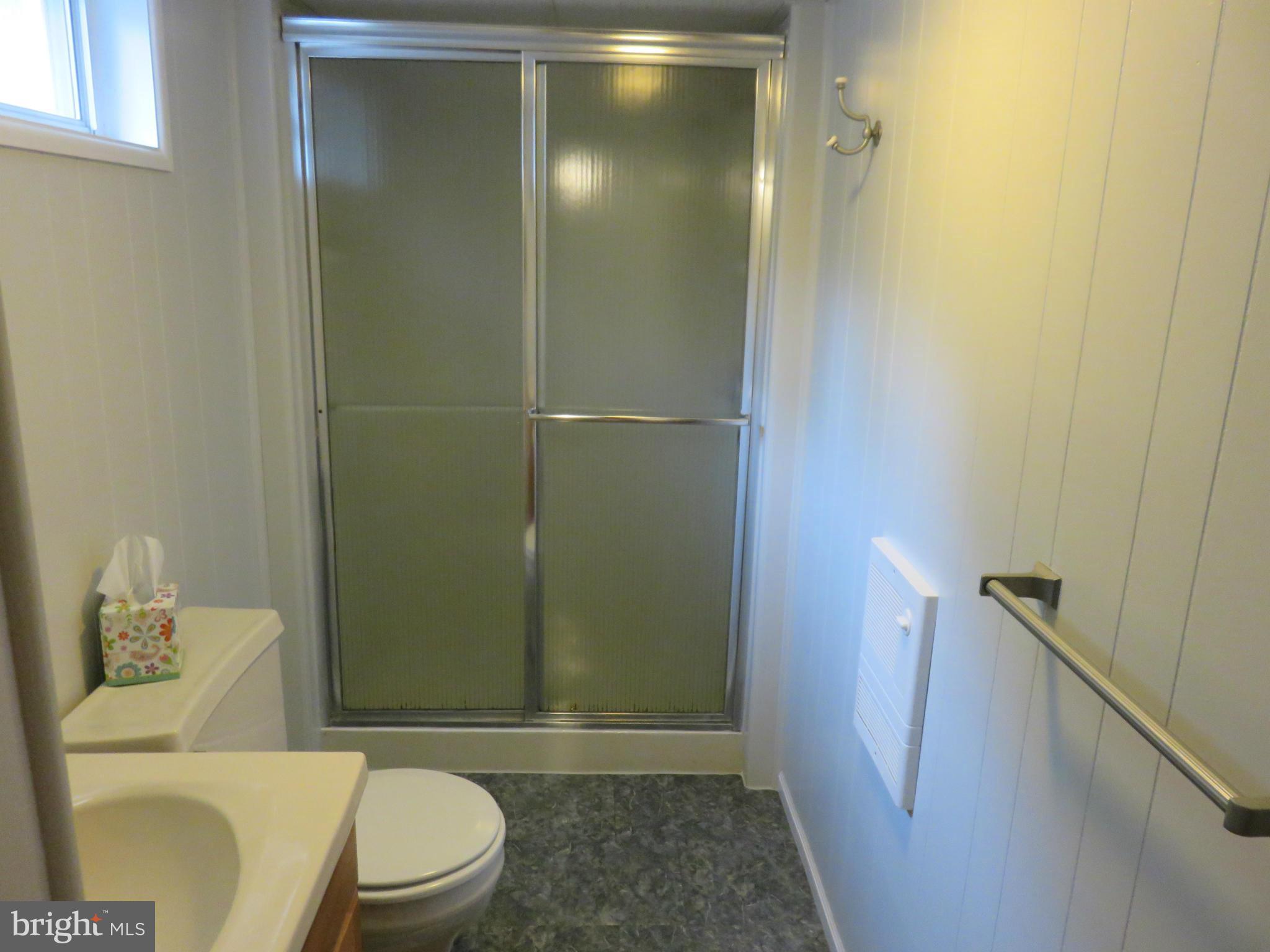 1930 Edgewood Road Baltimore, MD 21286 - Photo 24 of 30 a bathroom with a toilet and a shower