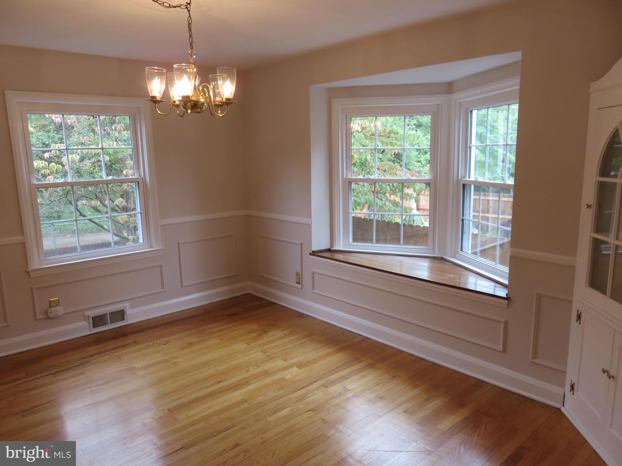 1930 Edgewood Road Baltimore, MD 21286 - Photo 4 of 30 a view of an empty room with wooden floor and a window