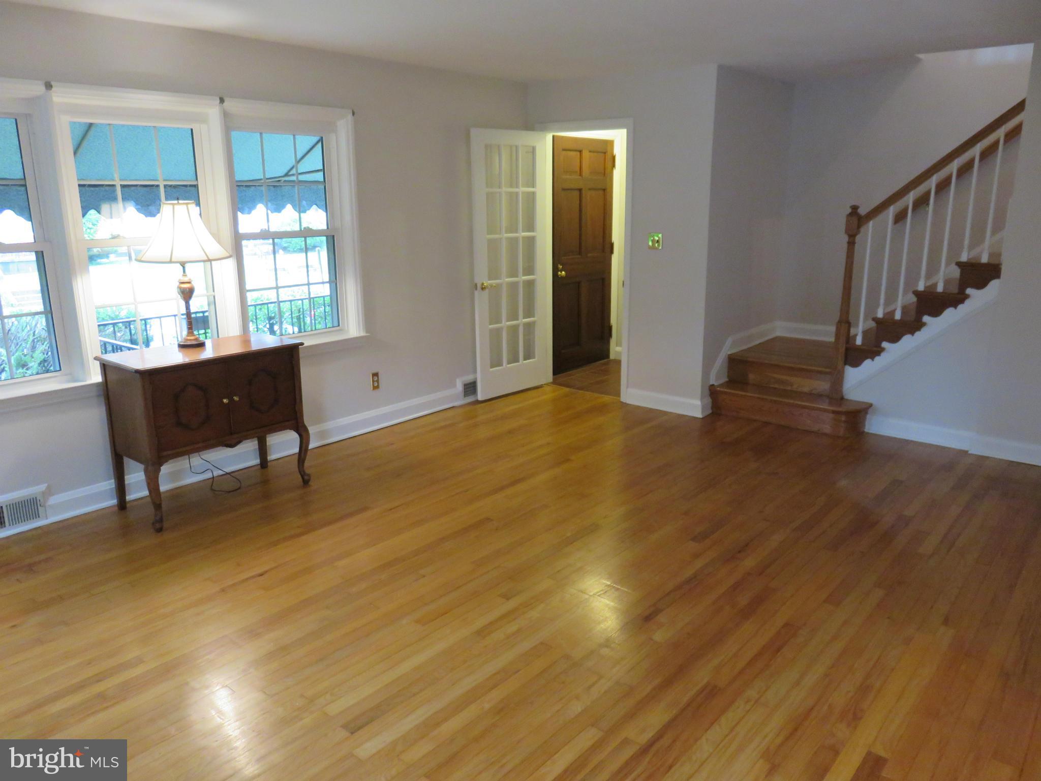 1930 Edgewood Road Baltimore, MD 21286 - Photo 5 of 30 a view of an empty room with wooden floor and a window