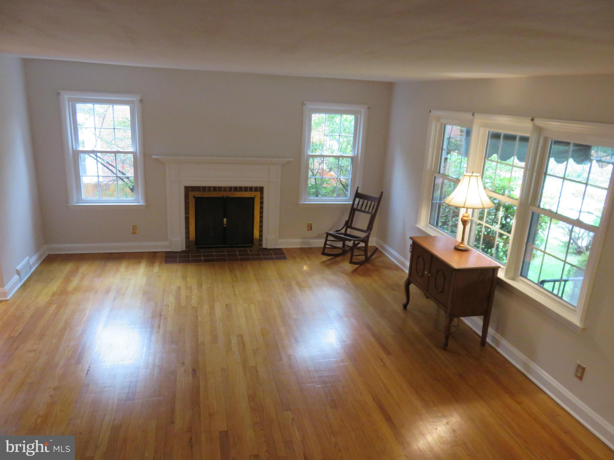 1930 Edgewood Road Baltimore, MD 21286 - Photo 7 of 30 a living room with furniture and a fireplace
