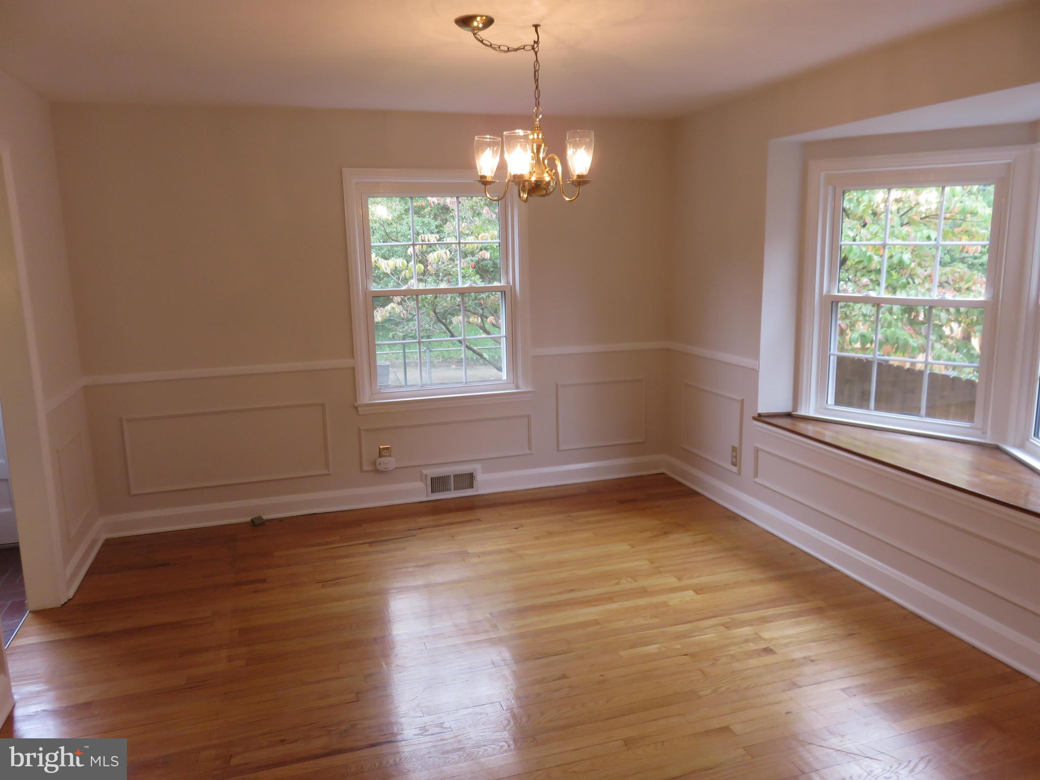 1930 Edgewood Road Baltimore, MD 21286 - Photo 10 of 30 a view of an empty room with wooden floor and a window