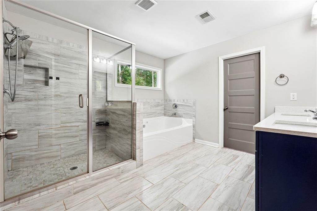 528 Clinton Drive Temple, GA 30179 - Photo 16 of 25 a bathroom with a bathtub and a sink