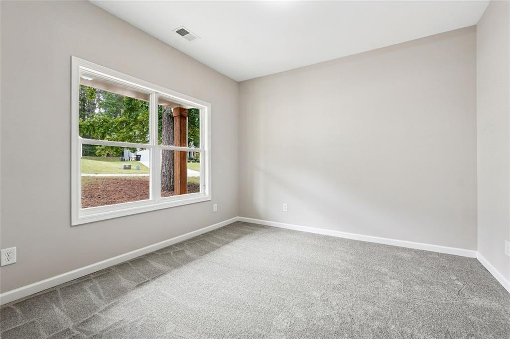 528 Clinton Drive Temple, GA 30179 - Photo 17 of 25 an empty room with a window