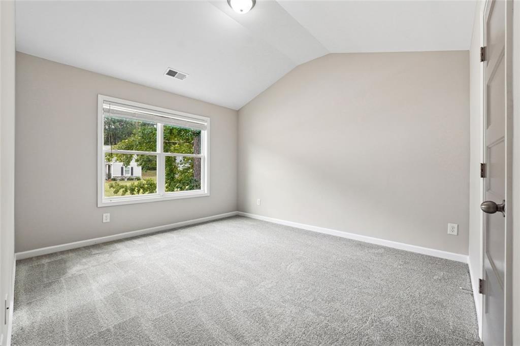 528 Clinton Drive Temple, GA 30179 - Photo 19 of 25 an empty room with windows and window