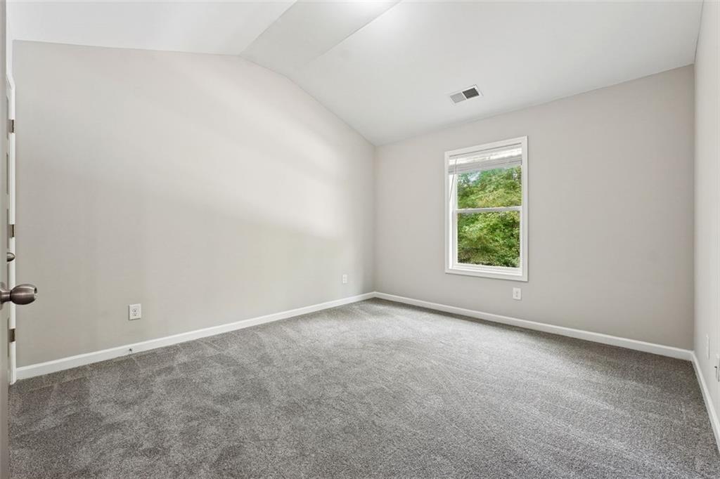 528 Clinton Drive Temple, GA 30179 - Photo 20 of 25 an empty room with windows