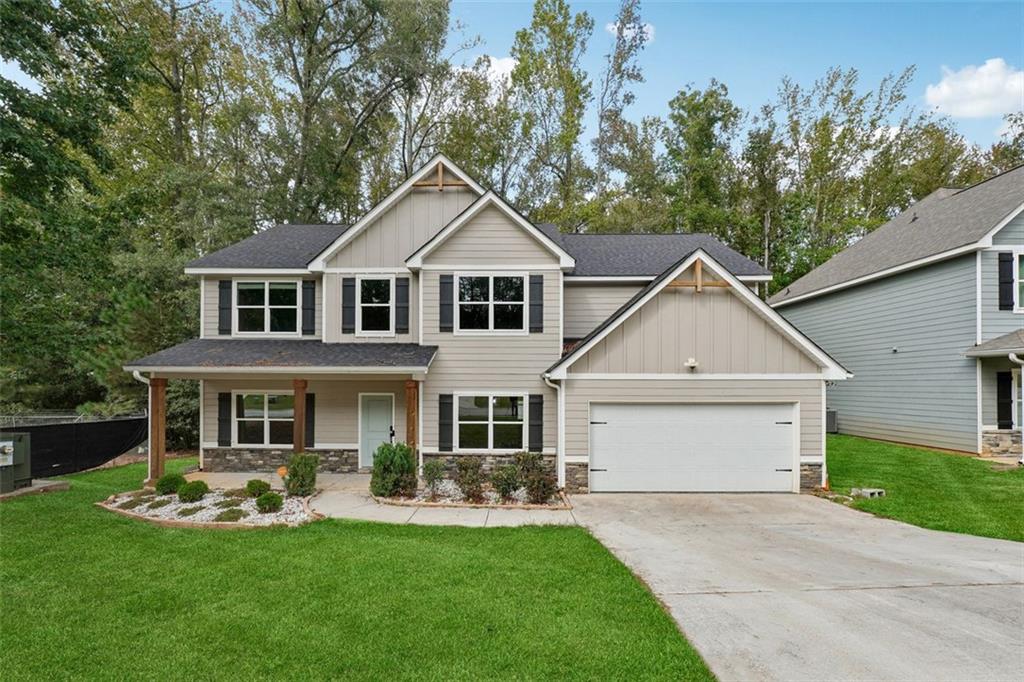 528 Clinton Drive Temple, GA 30179 - Photo 2 of 25 front view of a house with a yard