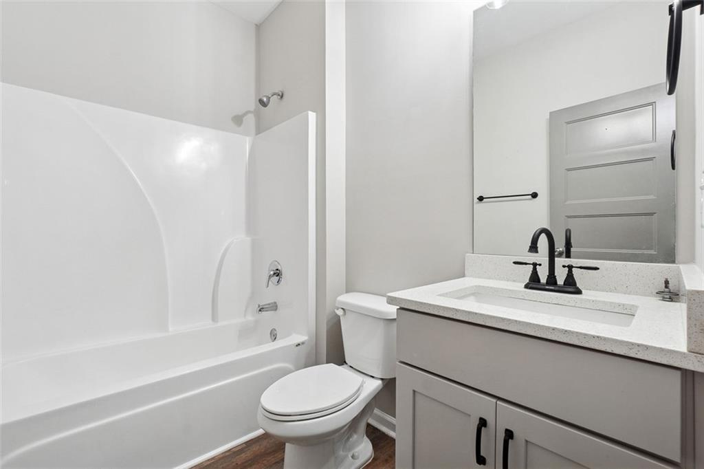 528 Clinton Drive Temple, GA 30179 - Photo 22 of 25 a bathroom with a sink toilet vanity and shower