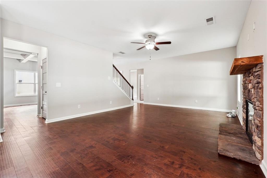 528 Clinton Drive Temple, GA 30179 - Photo 6 of 25 wooden floor in an empty room with a window