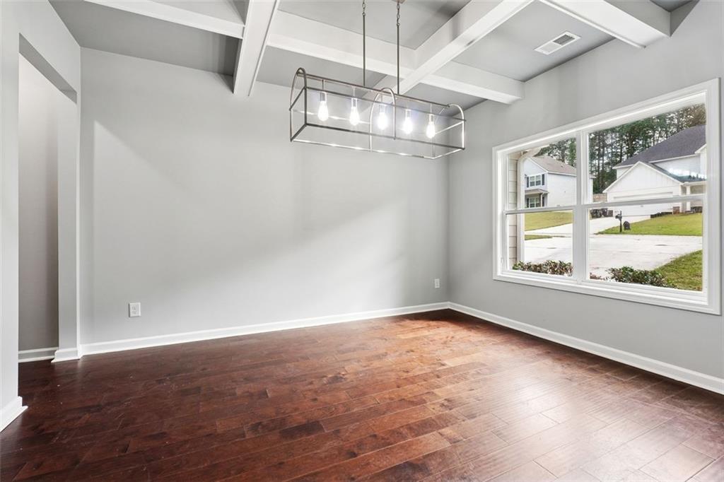 528 Clinton Drive Temple, GA 30179 - Photo 10 of 25 an empty room with a empty space and windows
