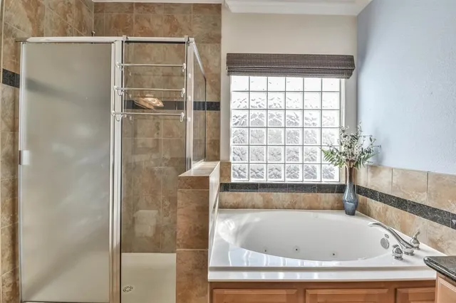 a bath tub sitting next to a window