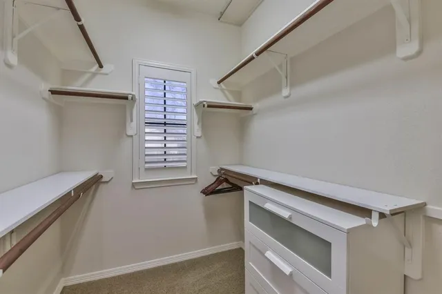 a view of storage and utility room with closet