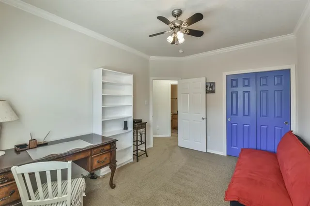 a bedroom with furniture and a chandelier