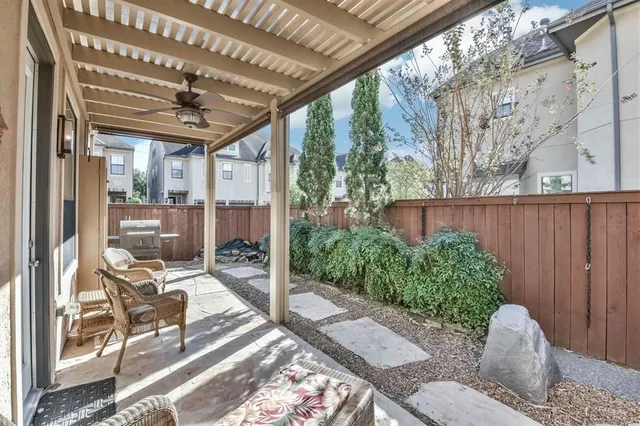 a view of a porch with furniture and next to a yard
