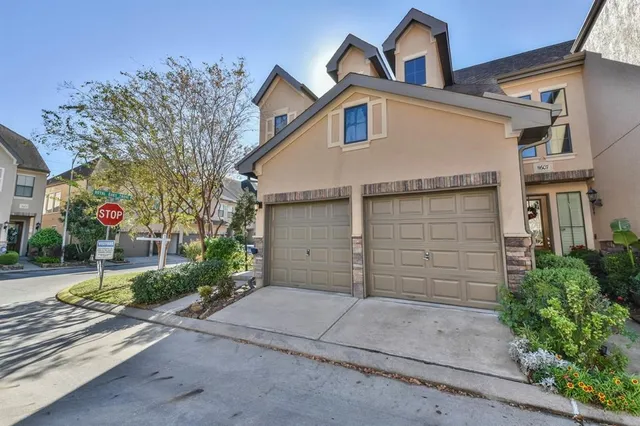 a front view of a house with a garage