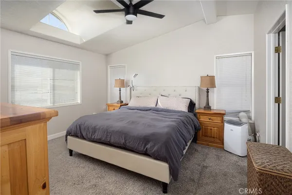 a bedroom with a bed and window