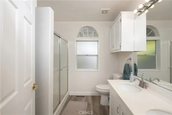 a bathroom with a sink toilet and mirror