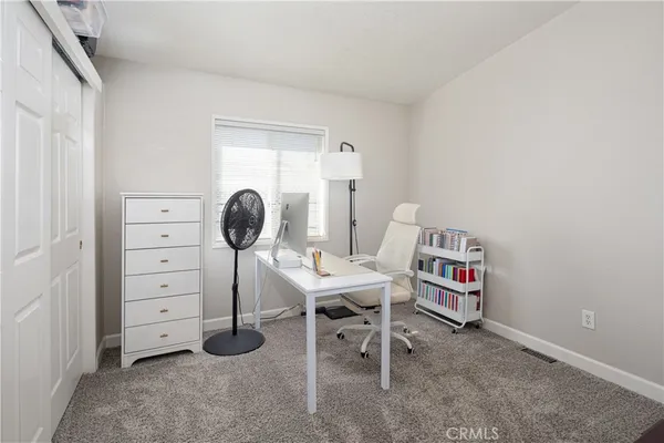 a view of a workspace with furniture