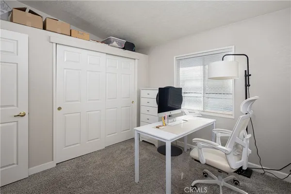 a workspace with furniture and wooden floor