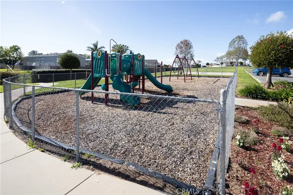 a view of a park with swings