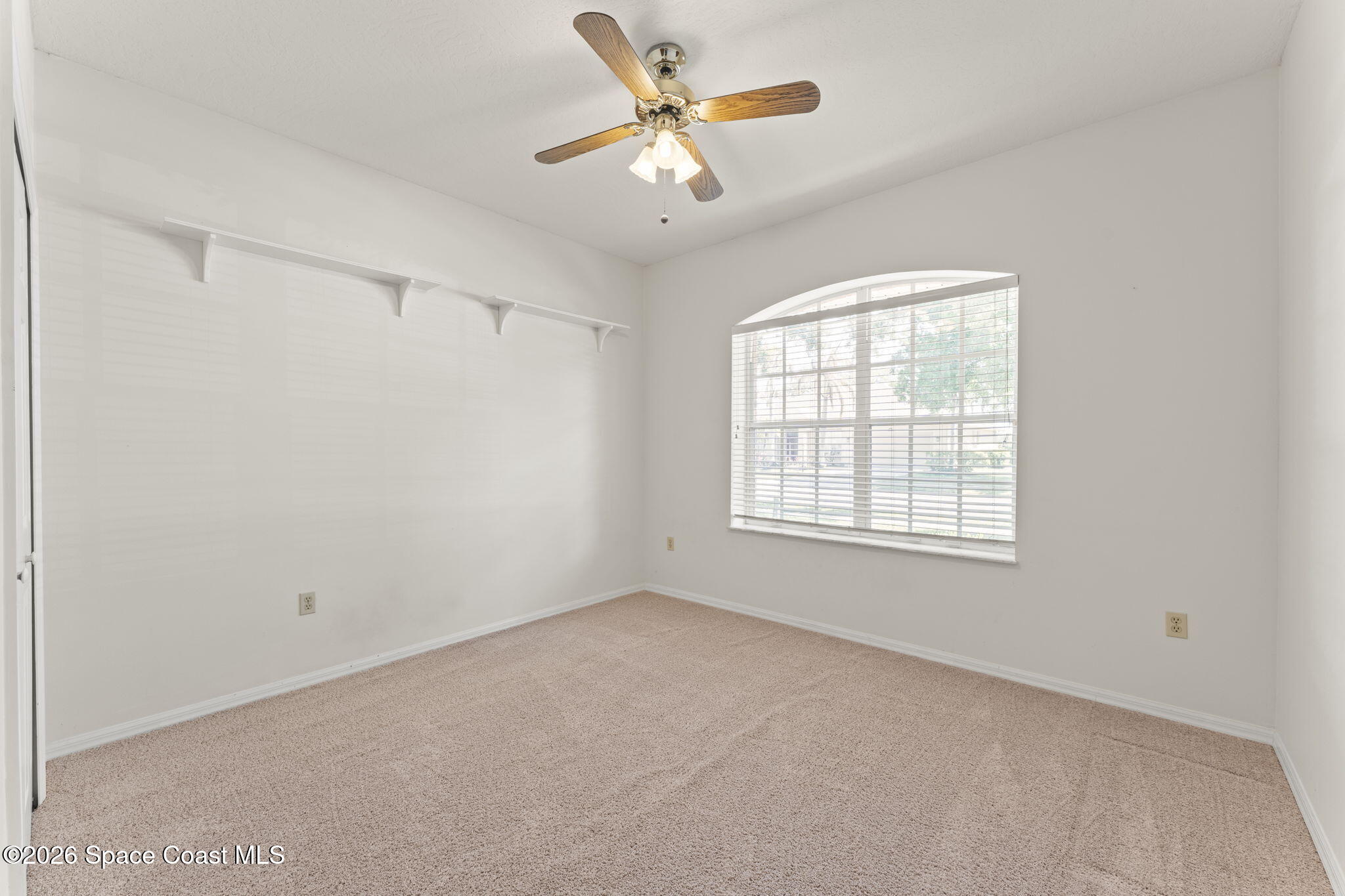 1123 Spring Oak Drive Melbourne, FL 32901 - Photo 40 of 67 a view of an empty room with a window