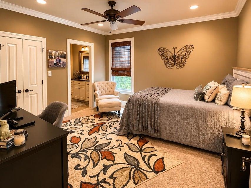 295 North Ridge Drive Saltillo, MS 38866 - Photo 22 of 38 a bedroom with a bed and wooden floor