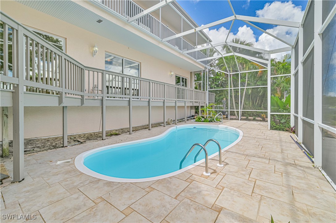 4230 Racoon Bay Drive Bonita Springs, FL 34134 - Photo 11 of 49 a view of a swimming pool with an outdoor space