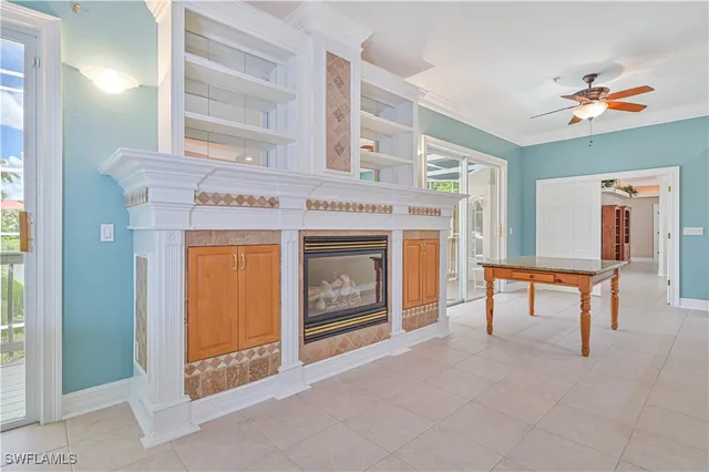 a view of a livingroom with furniture fireplace and window