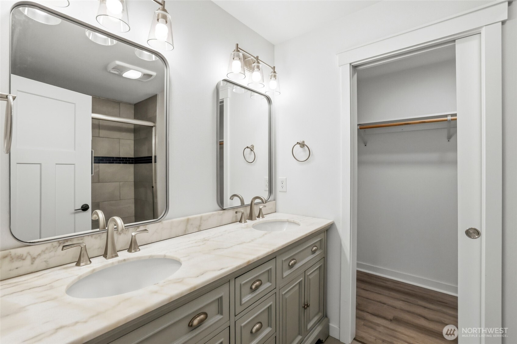 9815 178th Way Southwest Rochester, WA 98579 - Photo 25 of 36 a bathroom with a double vanity sink and a mirror