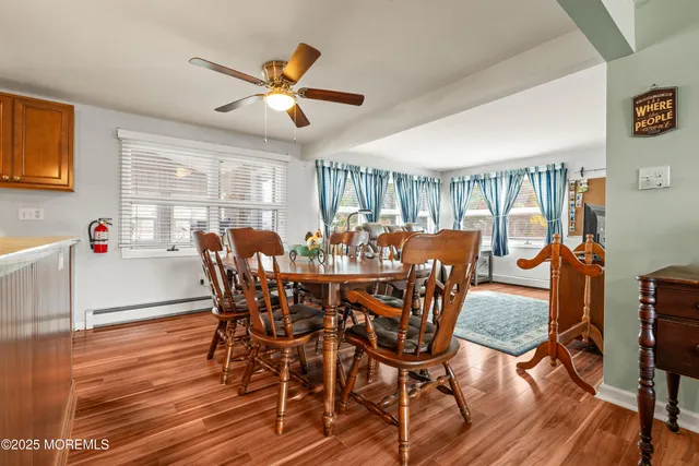 a kitchen with a refrigerator and a stove top oven