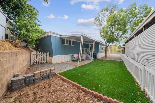 a view of a backyard with a patio