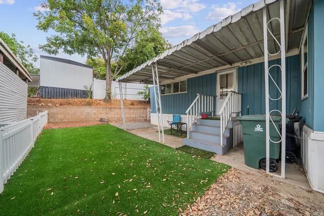 a view of a backyard with a patio