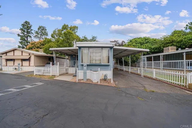 a view of a house with a outdoor space and balcony