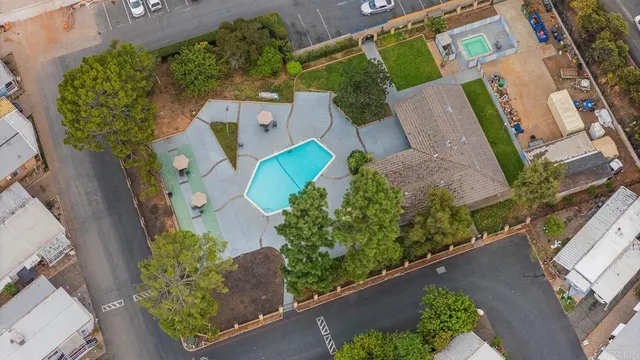 an aerial view of a house with a yard and a garden