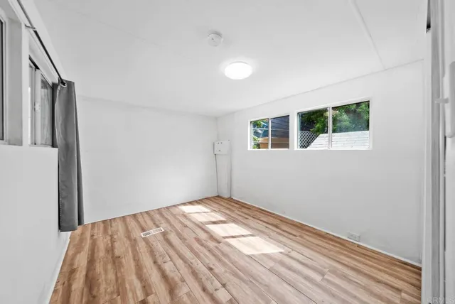 a view of empty room with windows