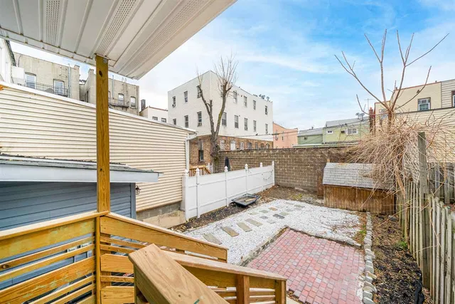 a view of a balcony with chairs