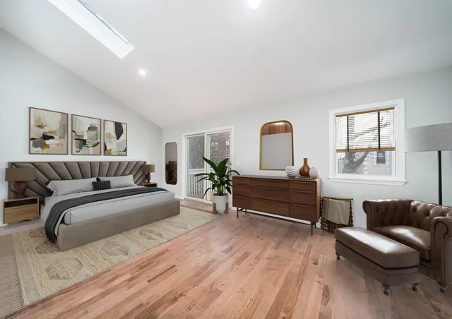 a bedroom with a bed and a couch