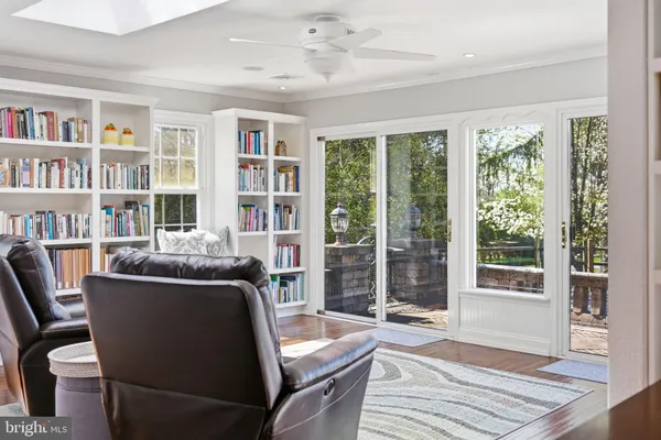 a kitchen with stainless steel appliances granite countertop a sink a stove and cabinets