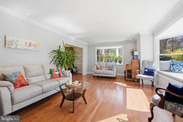 a bedroom with furniture and a flat screen tv