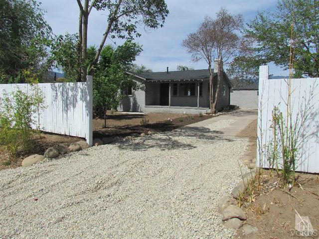 78 Chaparral Road Oak View, CA 93022 - Photo 1 of 1 a front view of a house with a yard and garage