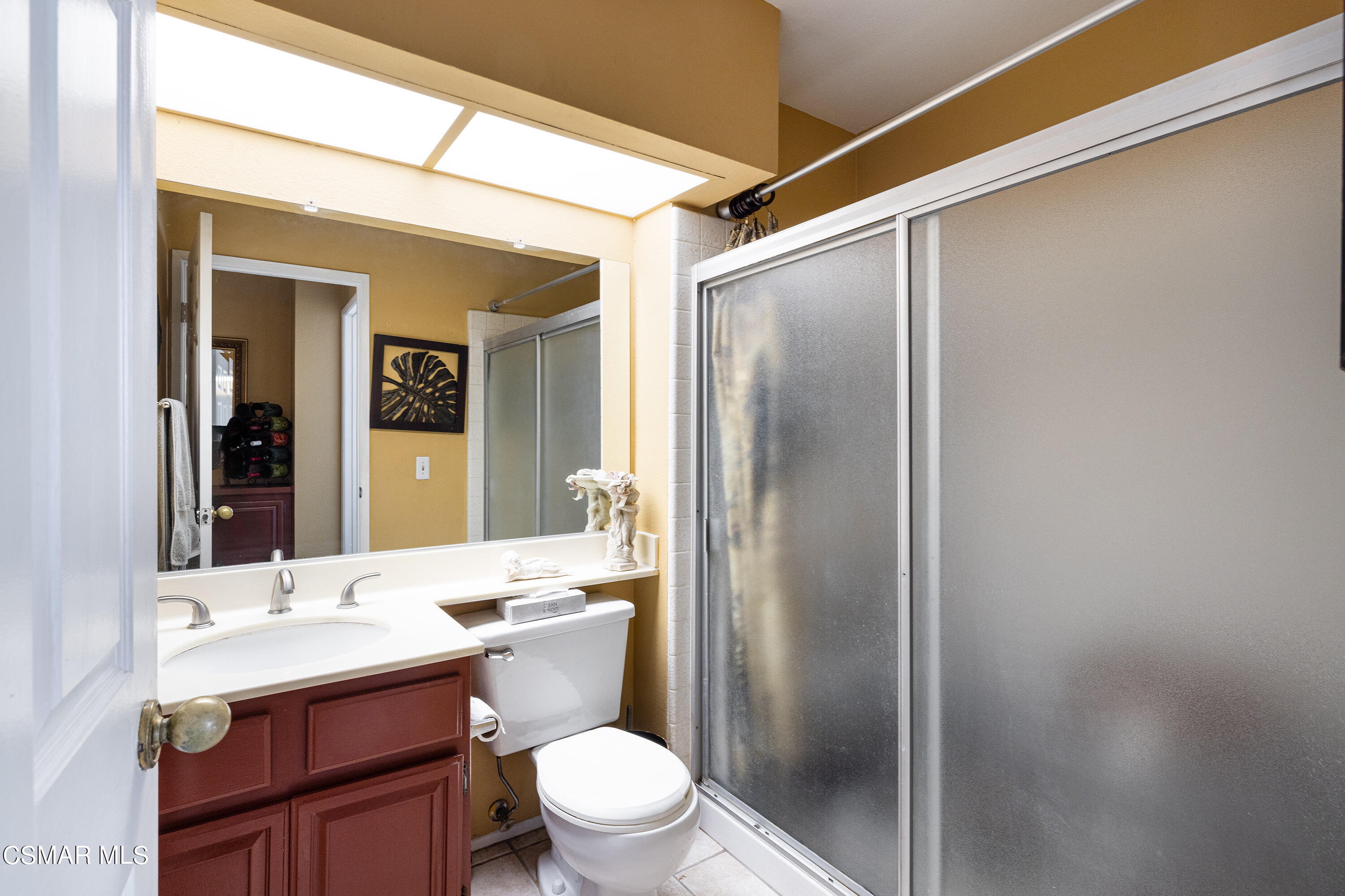 434 Algonquin Drive Simi Valley, CA 93065 - Photo 15 of 30 a bathroom with a sink a toilet a mirror and shower