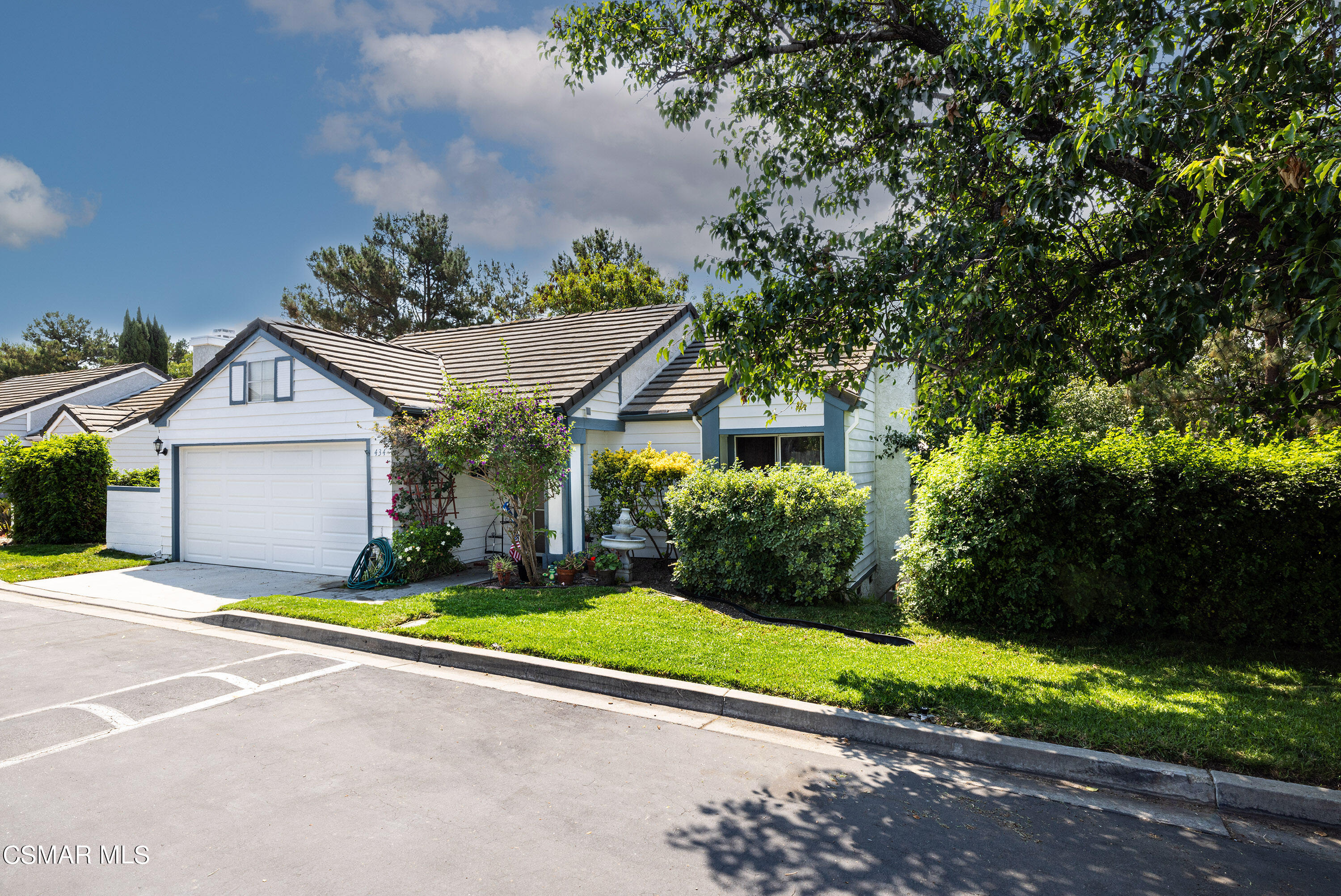 434 Algonquin Drive Simi Valley, CA 93065 - Photo 2 of 30 a front view of a house with a yard and garage