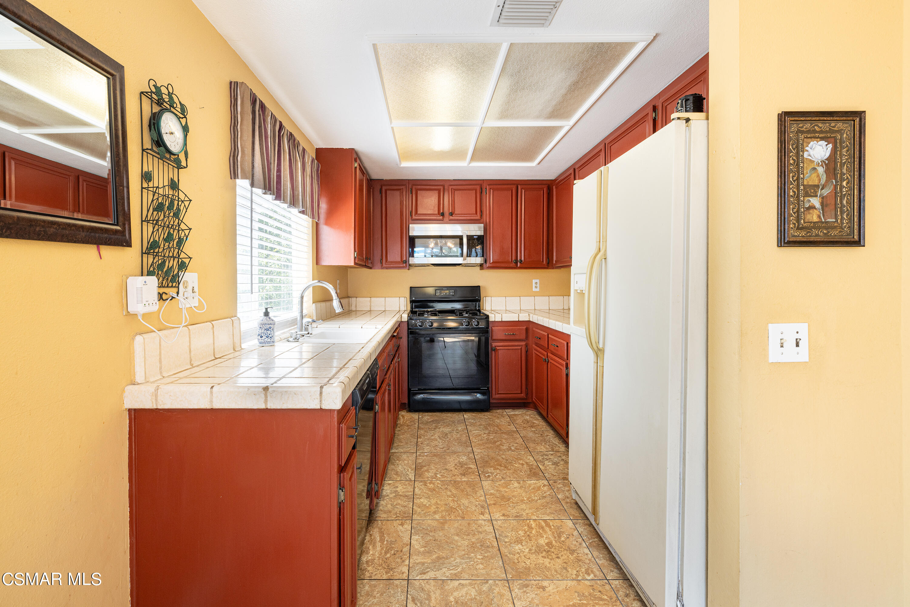 434 Algonquin Drive Simi Valley, CA 93065 - Photo 9 of 30 a kitchen with stainless steel appliances granite countertop a refrigerator a sink and a stove
