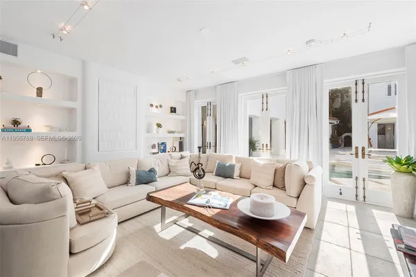 a living room with furniture and a table