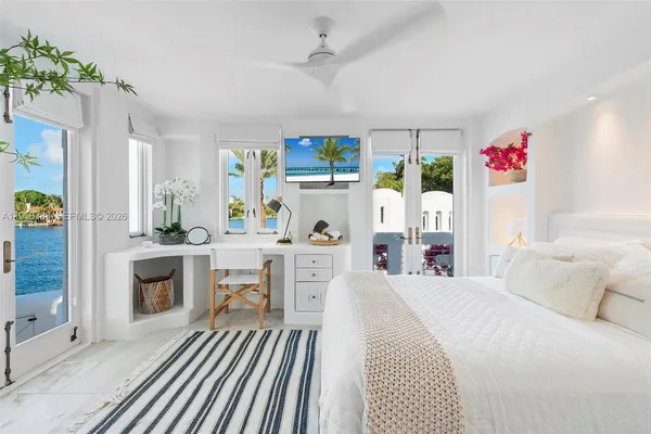 a bedroom with a bed and a fireplace