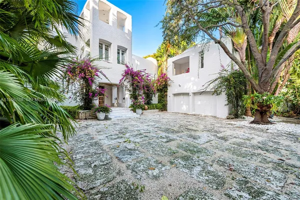 front view of a house with a trees