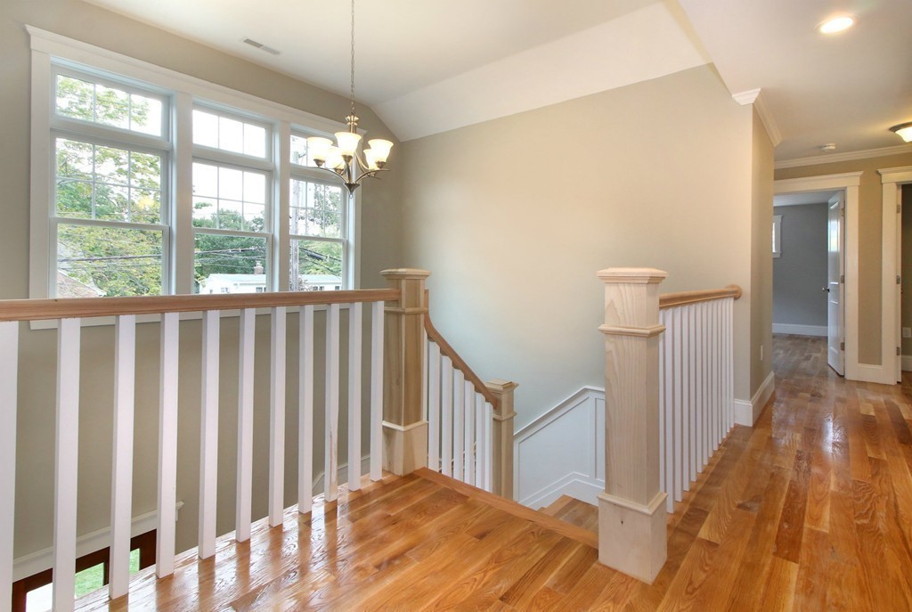 198 Overlook Road Arlington, MA 02474 - Photo 13 of 25 a view of a bedroom with wooden floor and windows