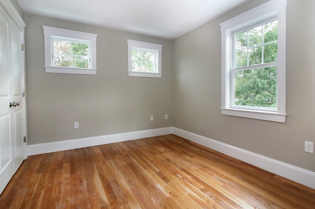 198 Overlook Road Arlington, MA 02474 - Photo 15 of 25 a view of an empty room with wooden floor and a window